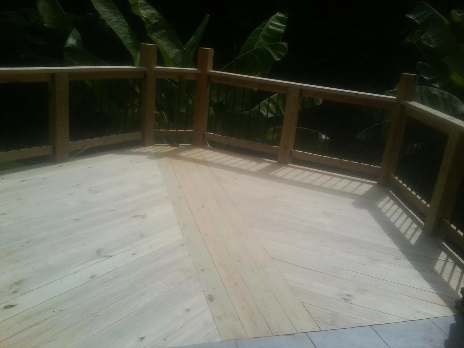 New wood deck and railing built off the back of a home in Ponca City